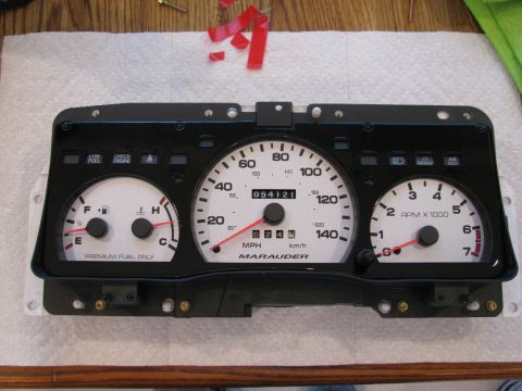 2003 Mercury Marauder - A vehicle's gauge cluster, identified as 'MARAUDER', is shown with its various dials and indicators.