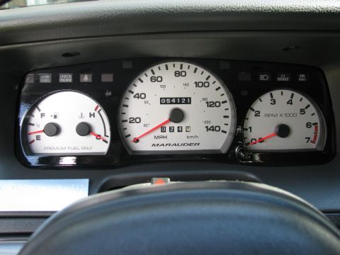 2003 Mercury Marauder - Installed. The contrast between the gloss black trim panel and silver gauges is oustanding.