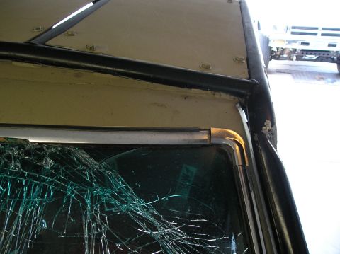 1986 Toyota Hilux - A damaged truck's windshield is visible, with another vehicle in the background.
