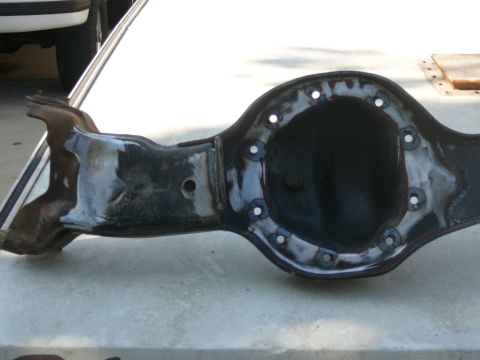 1988 Ford Bronco - A close-up view of a vehicle's differential housing, showing its internal components and mounting points.