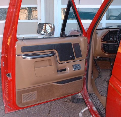 2006 Ford E350 - Interior door panel and dashboard detail of a vehicle.