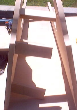 1999 Ford Taurus - Wooden console structure with bracing, power tool visible.