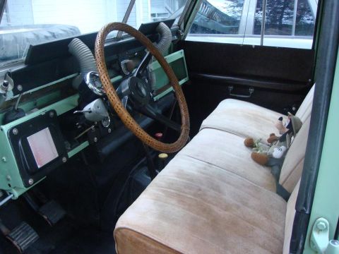 1967 Land Rover Land Rover - Interior view of a 1967 Land Rover Land Rover, the dashboard, steering wheel, and seats.