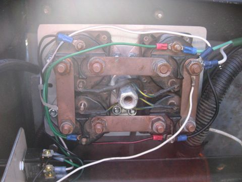 1990 Ford F-250 - Close-up view of an electrical relay assembly, showing copper bus bars, wiring, and connectors.
