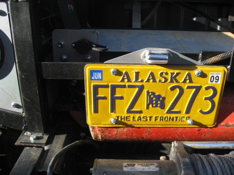 1990 Ford F-250 - Close-up of an Alaska license plate with the text 'The Last Frontier'.