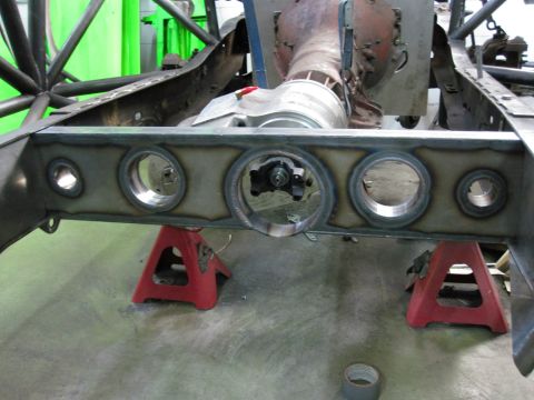 1995 Ford Bronco - Custom fabricated rear axle housing and suspension components are visible, supported by jack stands.