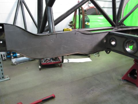 1995 Ford Bronco - Custom fabrication work on a vehicle frame, with roll cage structure visible.