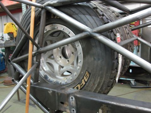1995 Ford Bronco - Custom roll cage structure surrounding a spare tire and wheel assembly.
