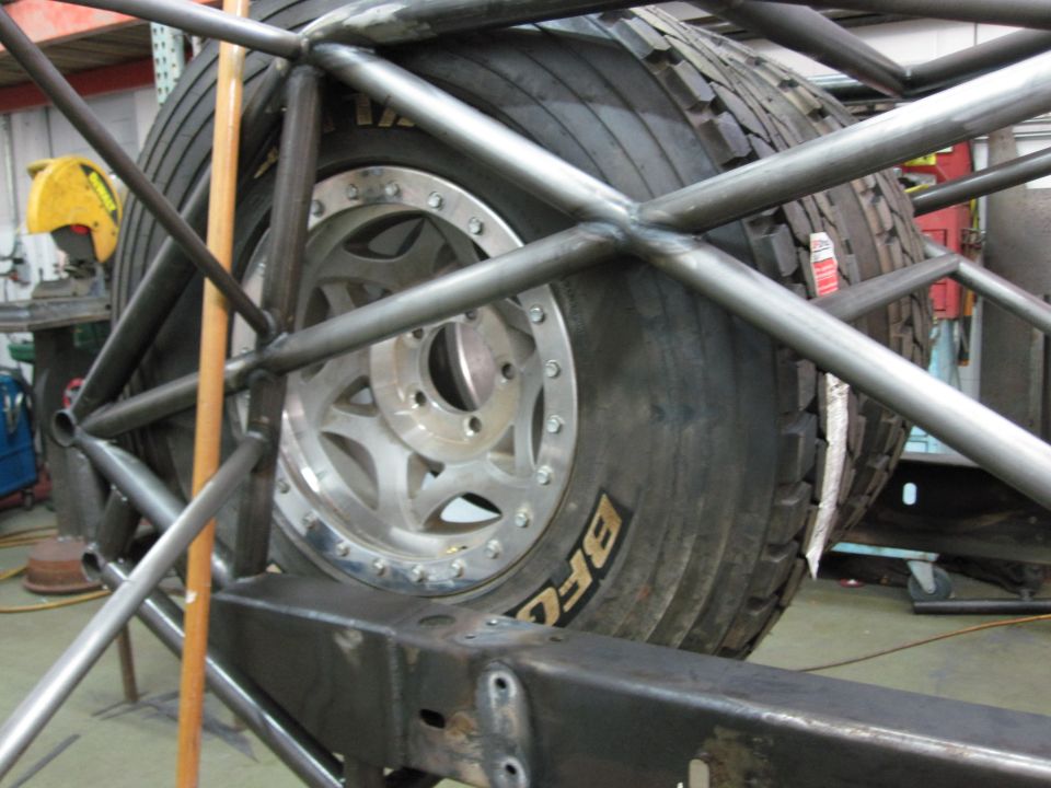 Spare tire mounted within a custom roll cage