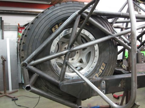 1995 Ford Bronco - Custom roll cage fabricated around a spare tire, likely for off-road use.