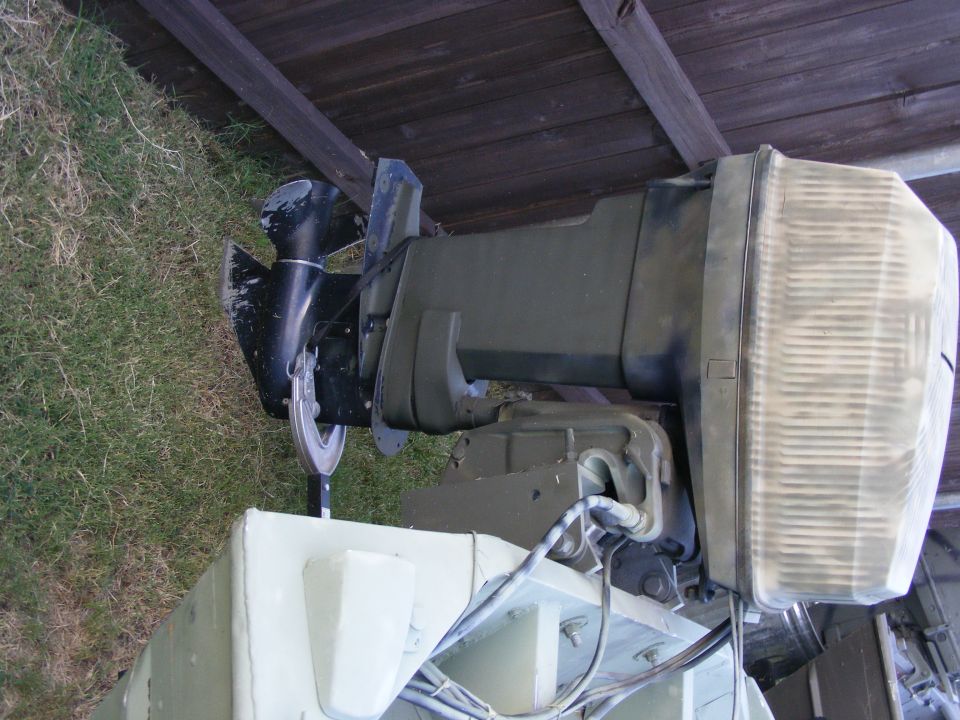 Outboard boat motor, green and black
