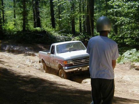 1989 Ford F-150 - Exiting mud hole on short trail behind Browns camp.