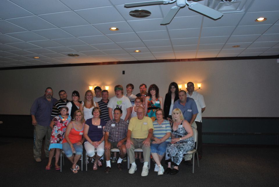 Group of people posing for a photo indoors
