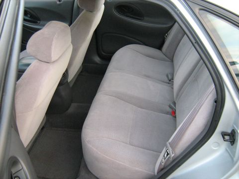 1988 Mercury Grand Marquis - Interior view of the rear seating area of a car with gray cloth upholstery.