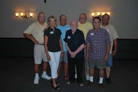 1996 Ford Bronco - Seven adults stand together in a room, some wearing name tags, for a group photograph.