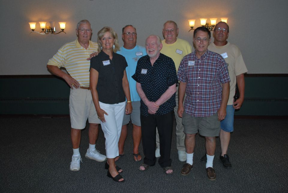 Group of people at a reunion, some wearing name tags