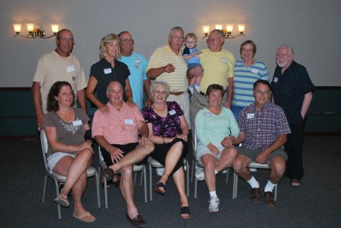 1996 Ford Bronco - A group of adults and one child pose for a reunion photo.