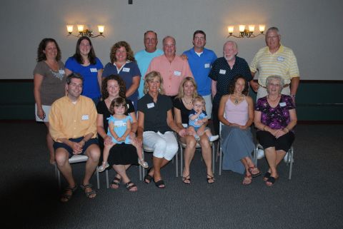 1996 Ford Bronco - A family reunion photo shows multiple generations gathered together.
