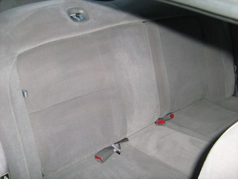 1988 Mercury Grand Marquis - Interior view of the rear seat and seatbelts in a 1988 Mercury Grand Marquis.