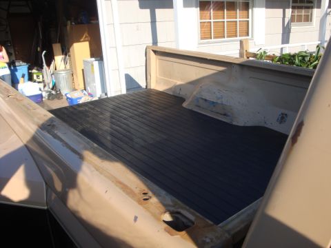 1988 Ford F-350 - Newly installed black liner in the bed of an older pickup truck.