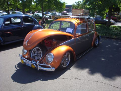 1964 Ford Fairlane - Customized Volkswagen Beetle with luggage rack and open hood displaying a spare tire.