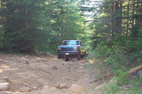 1989 Ford F-150 - Climbing the steep rocky hill on Firebreak Five, trail #14.