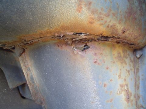 1988 Ford Bronco - Significant rust damage is visible on this vehicle's undercarriage structure.
