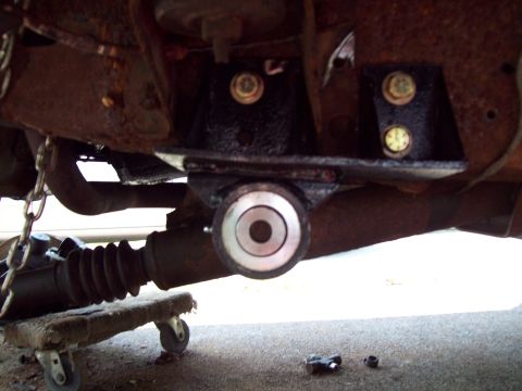 1989 Ford F-150 - Close-up of vehicle undercarriage showing suspension components and rust.