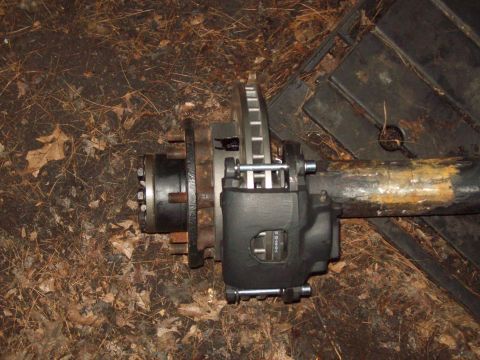 1989 Ford F-150 - Axle assembly with brake components, likely for a Ford F-150.