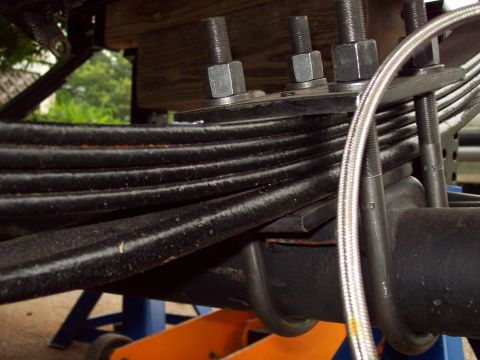 1989 Ford F-150 - Leaf springs and U-bolts are visible in this close-up shot.