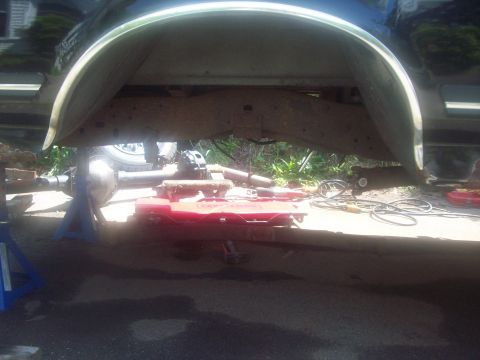 1989 Ford F-150 - Undercarriage view of a 1989 Ford F-150, with the rear axle supported by jack stands.