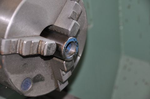 1996 Ford Bronco - Machining a threaded component held in a lathe chuck.