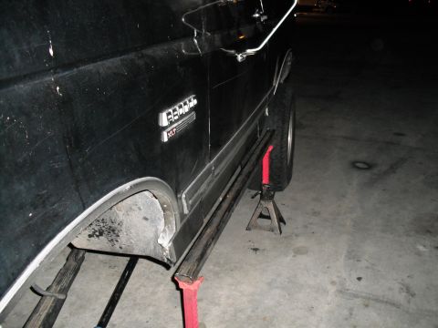 1991 Ford Bronco - 1991 Ford Bronco XLT is shown on jack stands for maintenance.
