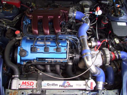 1995 Ford Probe - Customized Mazda engine a turbocharger, blue valve cover, and red intake manifold.