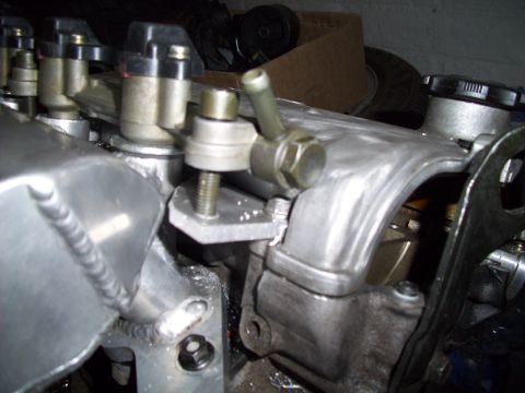 1995 Ford Probe - This is a close-up view of engine components, specifically the intake manifold and fuel injectors.