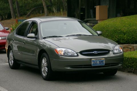 1990 Ford Taurus - This Ford Taurus has a distinctive grille and headlight design, suggesting a later model year than 1990.