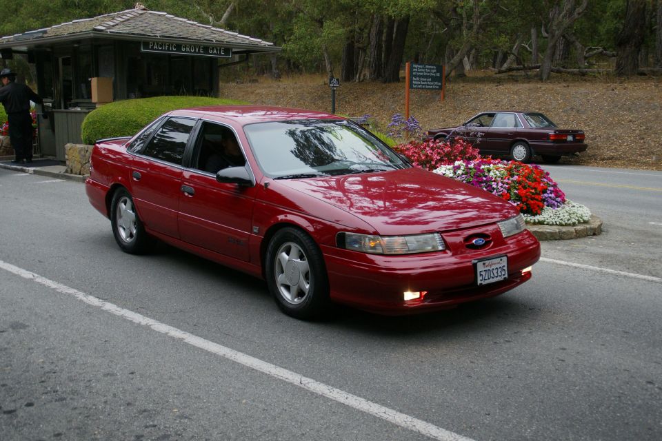 Red sedan with a license plate reading 5ZDS335, seen from a 3/4 front angle