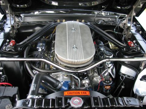 2003 Mercury Marauder - The engine bay features a prominent chrome air cleaner and a "CAUTION-FAN" warning sticker.