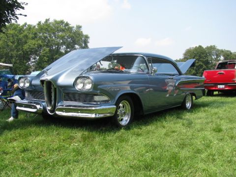 2003 Mercury Marauder - A 1958 Edsel Pacer is displayed with its hood and trunk open at an outdoor car show.