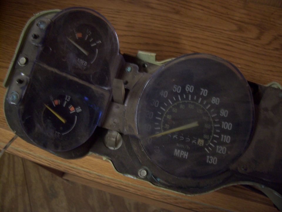 Dashboard gauges with speedometer, fuel gauge, and voltage meter