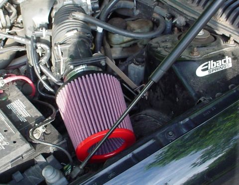 1999 Ford Taurus - Engine bay details including an aftermarket air filter and battery, with a visible Eibach Springs sticker.