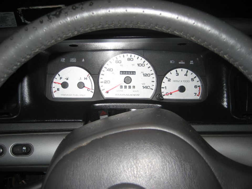 Marauder-badged gauge cluster reading 70,995 miles behind gray steering wheel