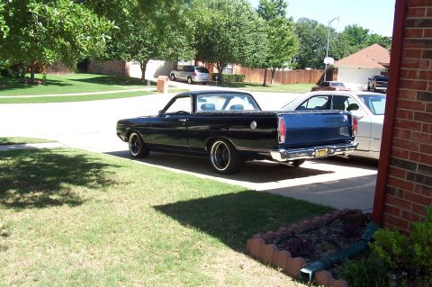 1969 Ford Ranchero - A dark blue 1968 Ford Ranchero is parked in a driveway next to another vehicle.