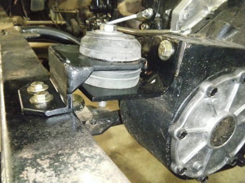 1978 Ford Bronco - This image shows a close-up view of a vehicle's engine mount, highlighting its connection to the frame.