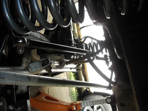 1979 Ford F-150 - Undercarriage view of a 1979 Ford F-150, showing the front suspension and steering components.