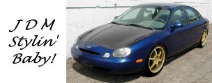 1999 Ford Taurus - A blue sedan with a black hood and gold rims is parked outside. Text on the left reads 'JDM Stylin' Baby!'.