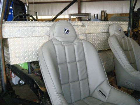 1978 Ford Bronco - Vehicle interior shows racing seats and a large toolbox mounted behind the seats.