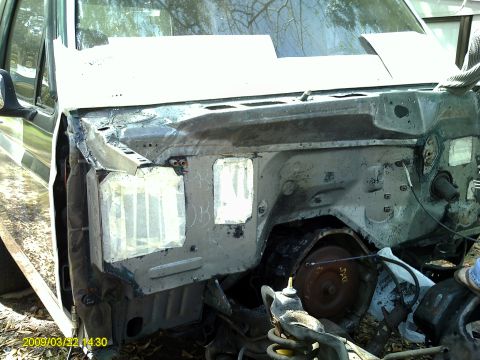 1992 Ford Bronco - Vehicle engine bay with parts removed, indicating ongoing repair work.