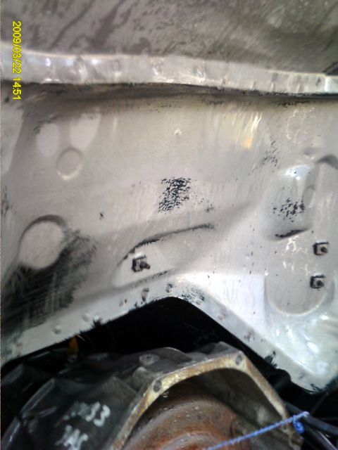 1992 Ford Bronco - Close-up of an engine bay interior, showing structural components and a visible part number.