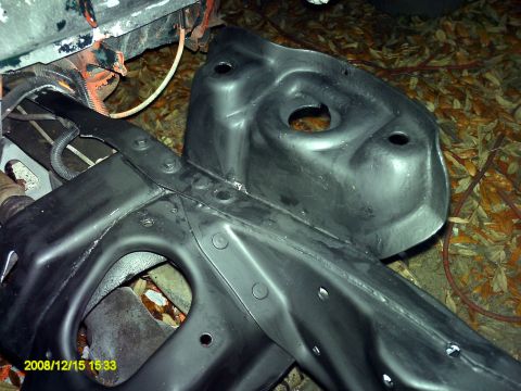 1992 Ford Bronco - A close-up view of a vehicle's frame component, showing its structural details and mounting points.